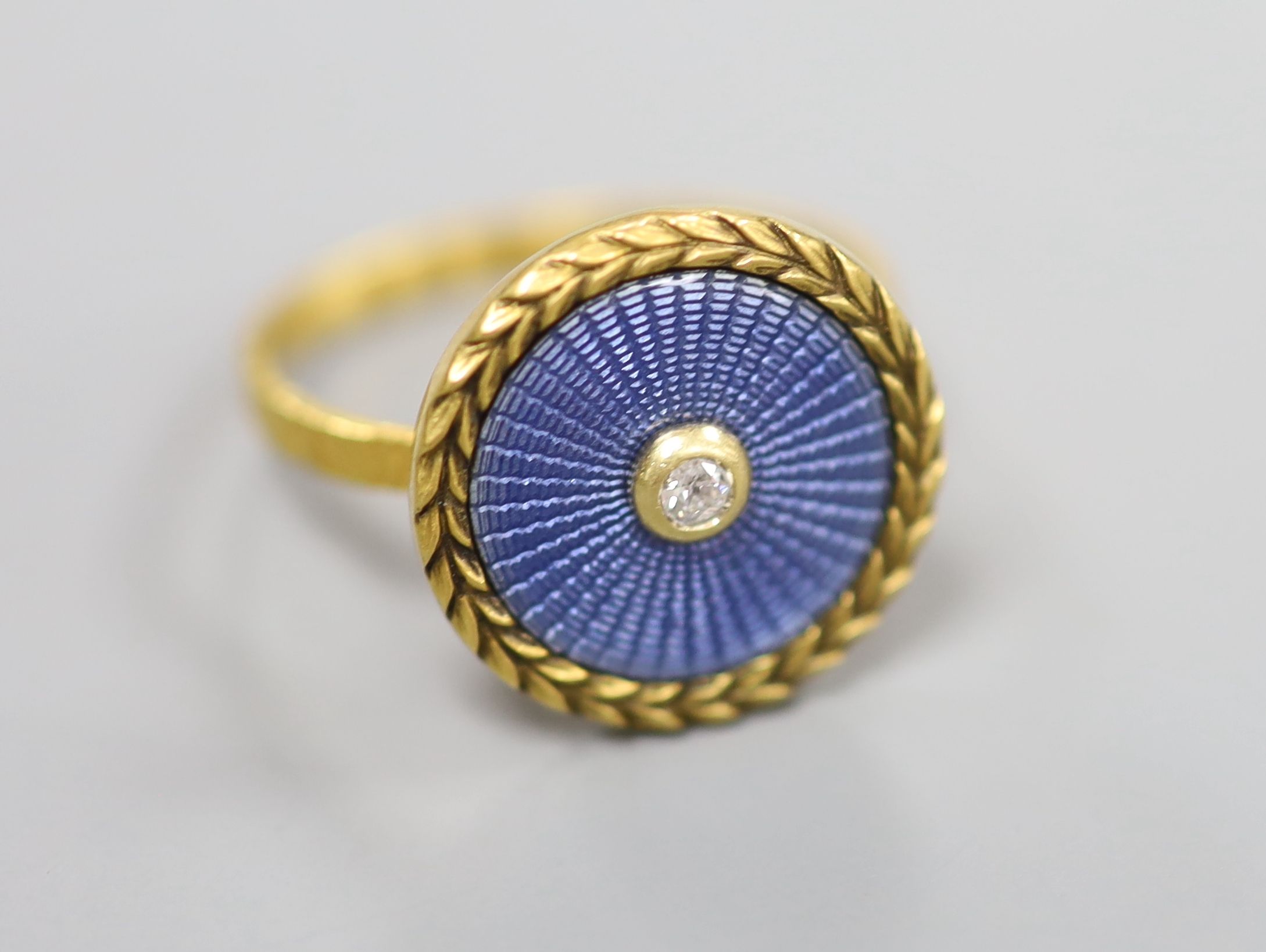 A yellow metal, blue guilloche enamel and diamond set button ring, size K, gross 3.1 grams (adapted),